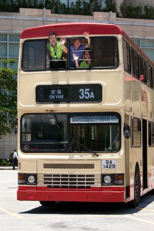 Bus Captain Wong Wai Kei (left), Senior Skilled Mechanic Au Ka Keung (middle) and Bus Captain Lam Yue Man (right) said farewell to non air-conditioned buses.
